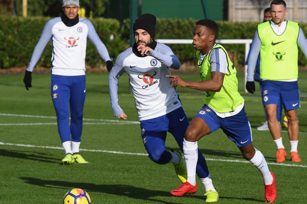 Cesc Fabregas challenges the ball with Charly Musonda during a 2017 Chelsea training session